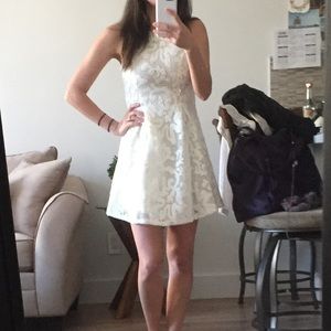 White mesh dress with leather appliqués